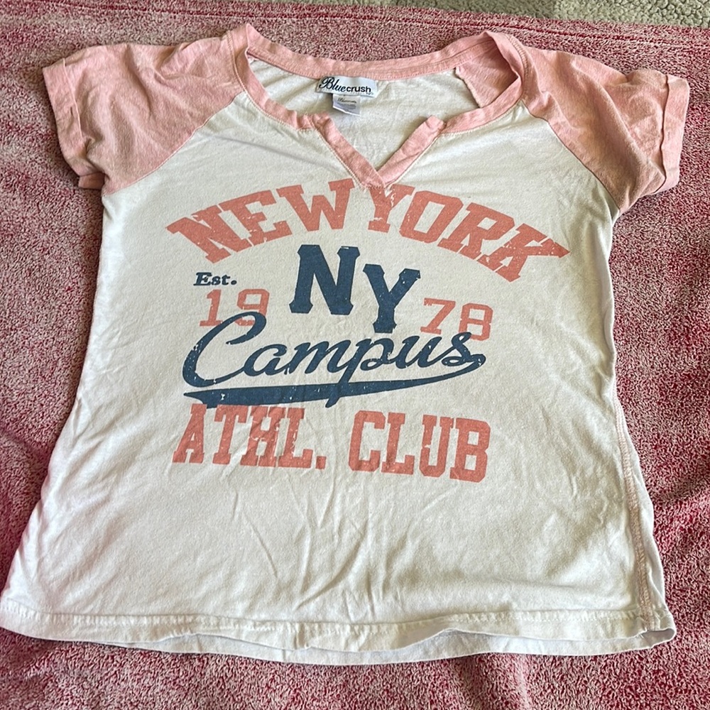 Female Bluecrush t-shirt, size small, pink and white with writing on the front.
